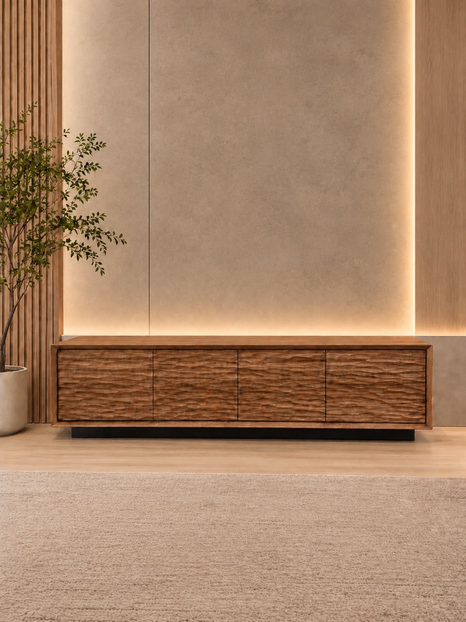 Low solid wood TV console with a textured front against a softly lit wall
